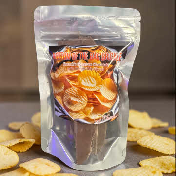 Bottom of The Bag Brickle bag on granite countertop surrounded by ruffled potato chips